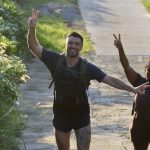 group of people smiling while on a hike in Koh Samui while attending Visit Natural Detox Resort yoga retreat